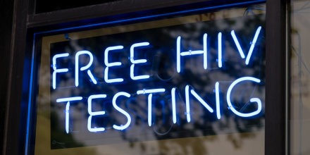 A blue neon free HIV testing sign